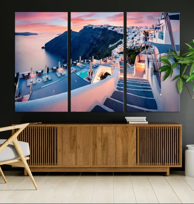 Greece Santorini Wall Art Landscape Canvas Print showcases a coastal village at sunset, featuring white buildings and an ocean view. The gallery-wrapped image is printed on museum-quality canvas for lasting beauty.