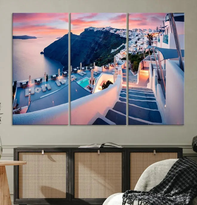 Greece Santorini Wall Art Landscape Canvas Print showcases a coastal village at sunset, featuring white buildings and an ocean view. The gallery-wrapped image is printed on museum-quality canvas for lasting beauty.