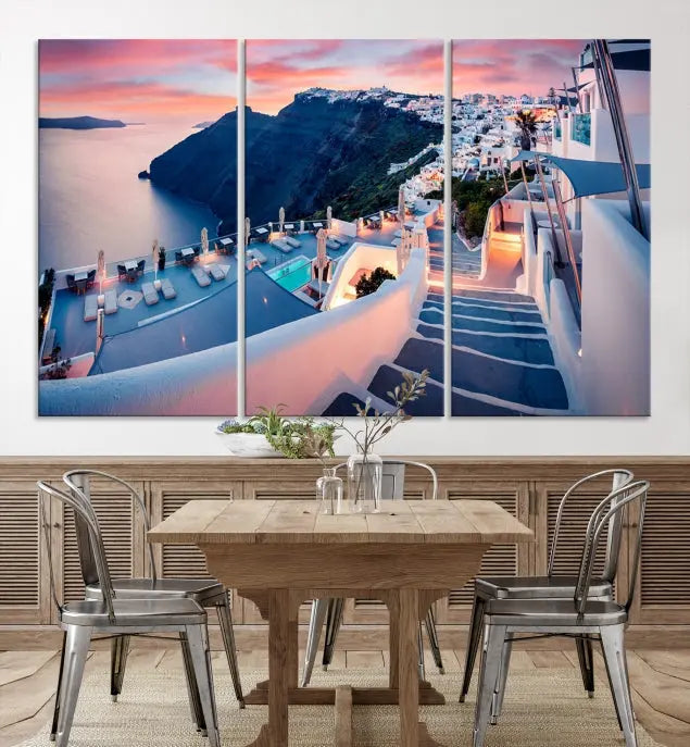 Greece Santorini Wall Art Landscape Canvas Print showcases a coastal village at sunset, featuring white buildings and an ocean view. The gallery-wrapped image is printed on museum-quality canvas for lasting beauty.