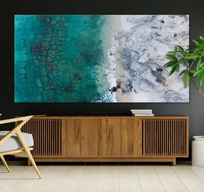 The Green Aerial Ocean Wall Art Canvas Print showcases a triptych of an aerial ocean view. Crafted on museum-quality canvas with gallery-wrapped edges and a UV-protective coating, it enhances both elegance and durability in your space.