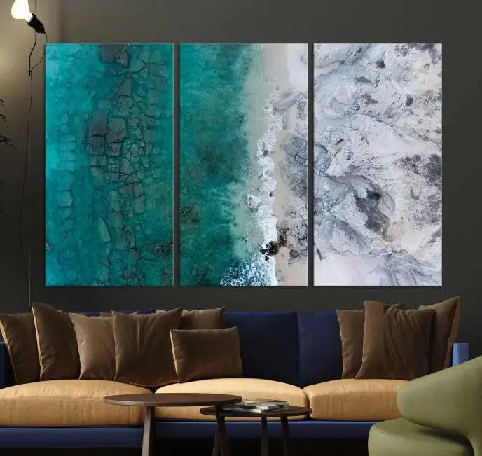 The Green Aerial Ocean Wall Art Canvas Print showcases a triptych of an aerial ocean view. Crafted on museum-quality canvas with gallery-wrapped edges and a UV-protective coating, it enhances both elegance and durability in your space.