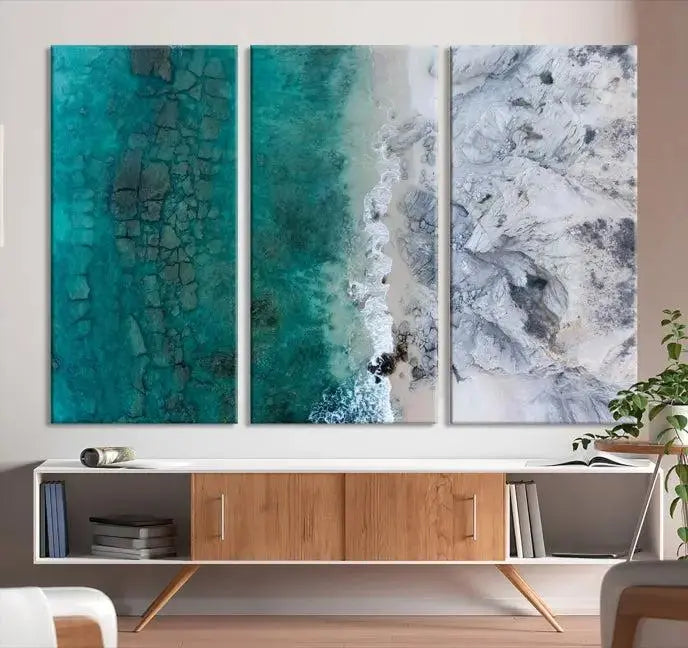 The Green Aerial Ocean Wall Art Canvas Print showcases a triptych of an aerial ocean view. Crafted on museum-quality canvas with gallery-wrapped edges and a UV-protective coating, it enhances both elegance and durability in your space.