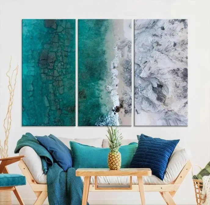 The Green Aerial Ocean Wall Art Canvas Print showcases a triptych of an aerial ocean view. Crafted on museum-quality canvas with gallery-wrapped edges and a UV-protective coating, it enhances both elegance and durability in your space.