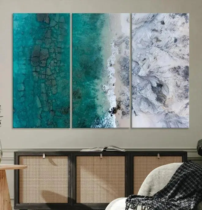 The Green Aerial Ocean Wall Art Canvas Print showcases a triptych of an aerial ocean view. Crafted on museum-quality canvas with gallery-wrapped edges and a UV-protective coating, it enhances both elegance and durability in your space.