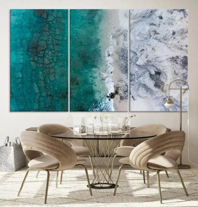 The Green Aerial Ocean Wall Art Canvas Print showcases a triptych of an aerial ocean view. Crafted on museum-quality canvas with gallery-wrapped edges and a UV-protective coating, it enhances both elegance and durability in your space.