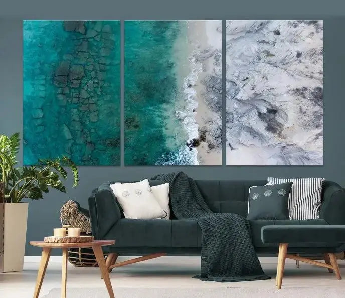 The Green Aerial Ocean Wall Art Canvas Print showcases a triptych of an aerial ocean view. Crafted on museum-quality canvas with gallery-wrapped edges and a UV-protective coating, it enhances both elegance and durability in your space.