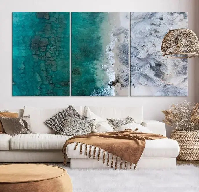 The Green Aerial Ocean Wall Art Canvas Print showcases a triptych of an aerial ocean view. Crafted on museum-quality canvas with gallery-wrapped edges and a UV-protective coating, it enhances both elegance and durability in your space.