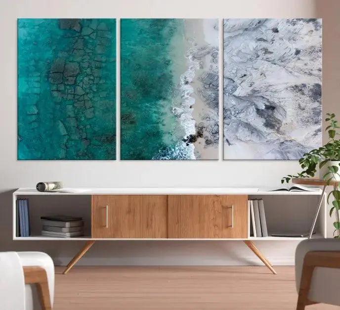 The Green Aerial Ocean Wall Art Canvas Print showcases a triptych of an aerial ocean view. Crafted on museum-quality canvas with gallery-wrapped edges and a UV-protective coating, it enhances both elegance and durability in your space.