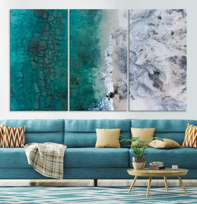 The Green Aerial Ocean Wall Art Canvas Print showcases a triptych of an aerial ocean view. Crafted on museum-quality canvas with gallery-wrapped edges and a UV-protective coating, it enhances both elegance and durability in your space.