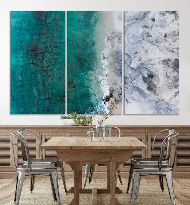 The Green Aerial Ocean Wall Art Canvas Print showcases a triptych of an aerial ocean view. Crafted on museum-quality canvas with gallery-wrapped edges and a UV-protective coating, it enhances both elegance and durability in your space.