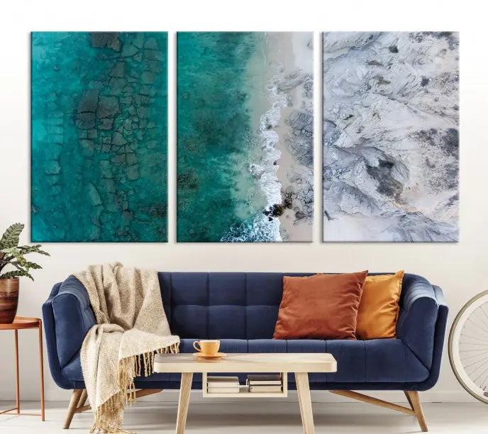 The Green Aerial Ocean Wall Art Canvas Print showcases a triptych of an aerial ocean view. Crafted on museum-quality canvas with gallery-wrapped edges and a UV-protective coating, it enhances both elegance and durability in your space.