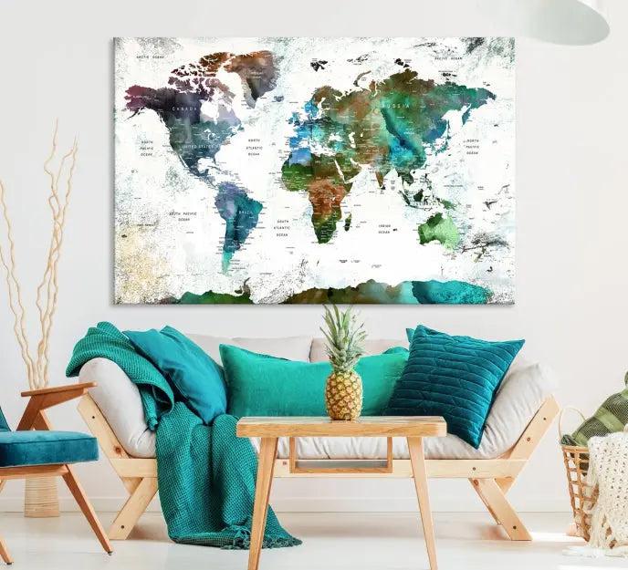 The Green Color Map of World Wall Art Canvas Print, featuring colorful continents and handmade in the USA, is displayed on the wall. These museum-quality canvases are finished with a UV-protective coating to ensure lasting vibrancy.