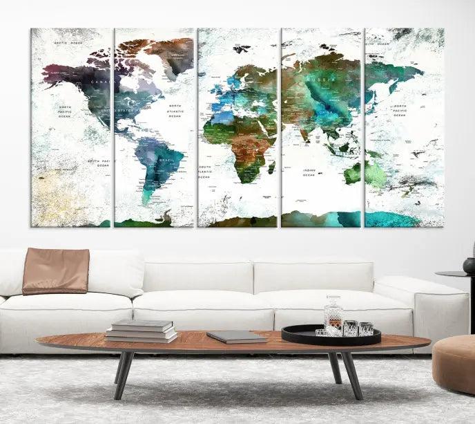 The Green Color Map of World Wall Art Canvas Print, featuring colorful continents and handmade in the USA, is displayed on the wall. These museum-quality canvases are finished with a UV-protective coating to ensure lasting vibrancy.