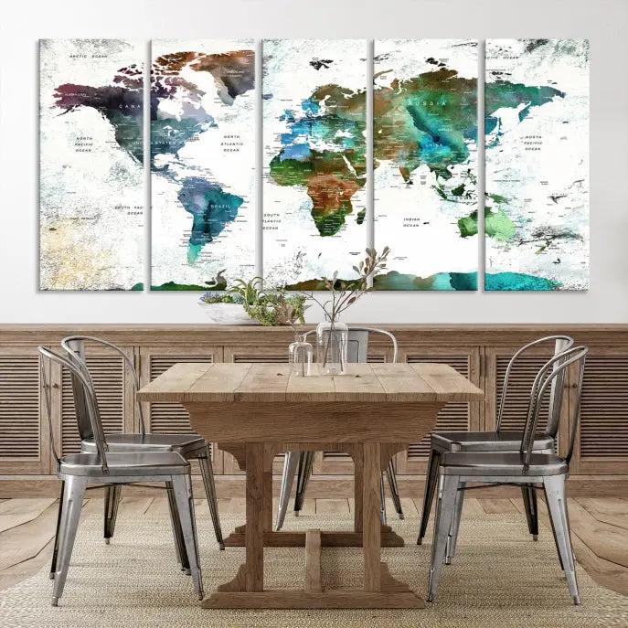 The Green Color Map of World Wall Art Canvas Print, featuring colorful continents and handmade in the USA, is displayed on the wall. These museum-quality canvases are finished with a UV-protective coating to ensure lasting vibrancy.