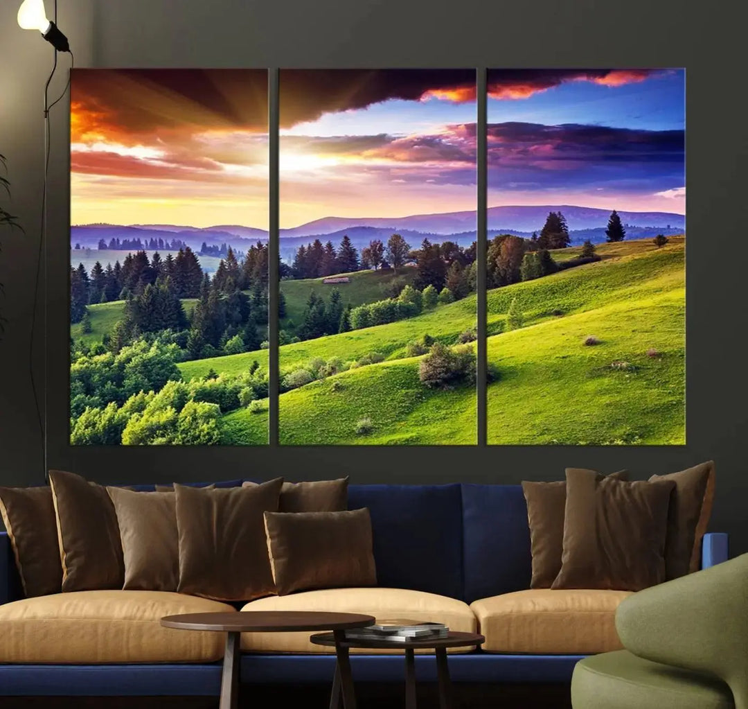 The room features a large triptych of the Green Hills and Sunset Wall Art Print, showcasing a scenic landscape with lush greenery and a vibrant sky.