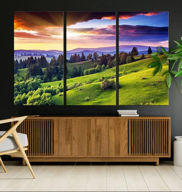 The room features a large triptych of the Green Hills and Sunset Wall Art Print, showcasing a scenic landscape with lush greenery and a vibrant sky.