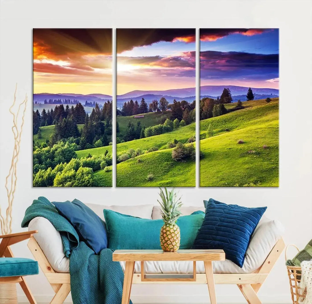 The room features a large triptych of the Green Hills and Sunset Wall Art Print, showcasing a scenic landscape with lush greenery and a vibrant sky.