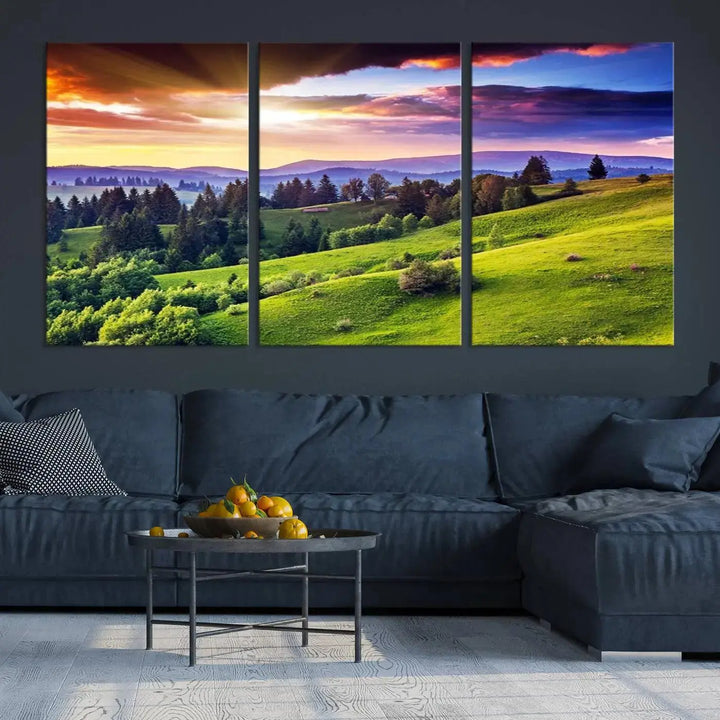 The room features a large triptych of the Green Hills and Sunset Wall Art Print, showcasing a scenic landscape with lush greenery and a vibrant sky.