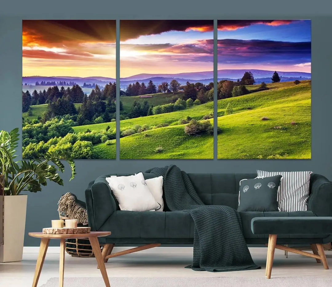 The room features a large triptych of the Green Hills and Sunset Wall Art Print, showcasing a scenic landscape with lush greenery and a vibrant sky.