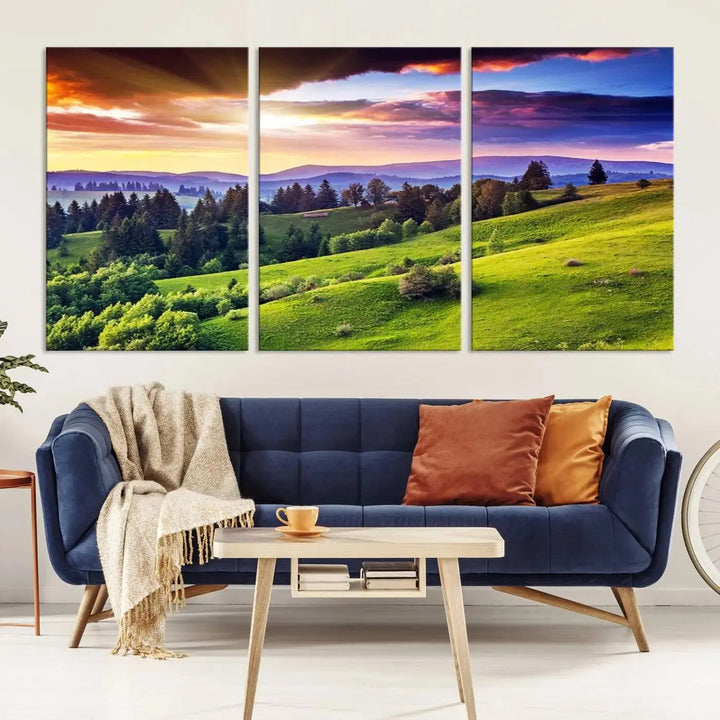 The room features a large triptych of the Green Hills and Sunset Wall Art Print, showcasing a scenic landscape with lush greenery and a vibrant sky.