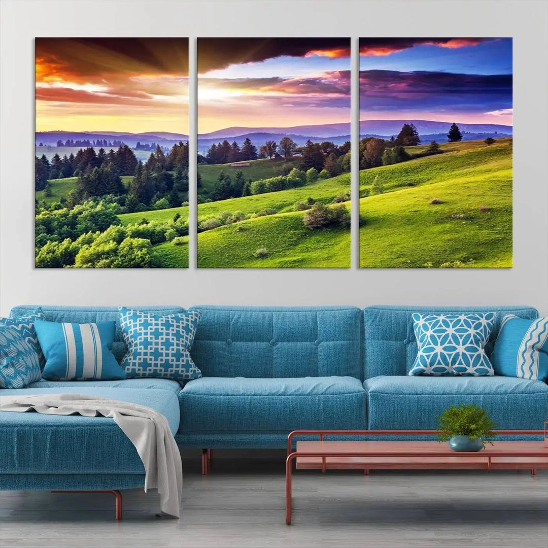 The room features a large triptych of the Green Hills and Sunset Wall Art Print, showcasing a scenic landscape with lush greenery and a vibrant sky.