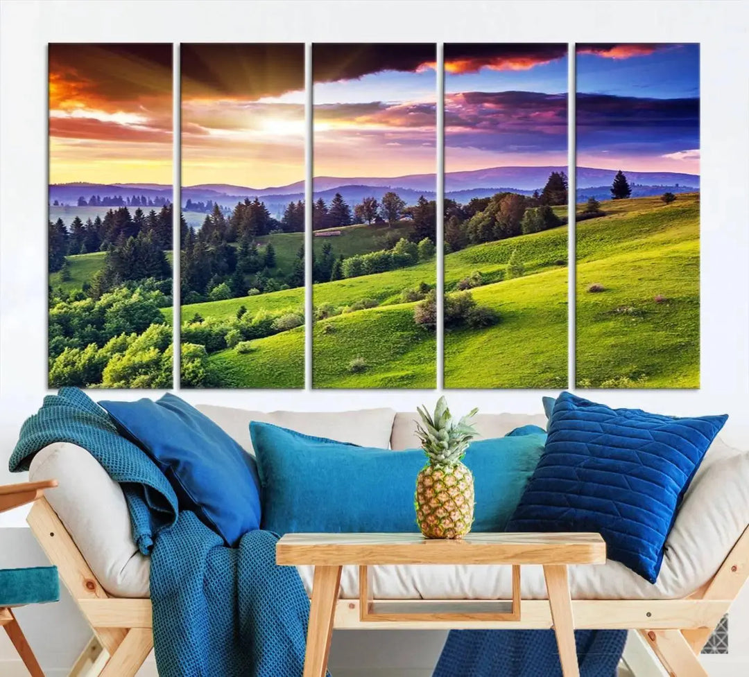 The room features a large triptych of the Green Hills and Sunset Wall Art Print, showcasing a scenic landscape with lush greenery and a vibrant sky.