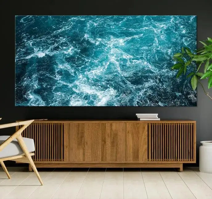 The Green Ocean Waves Wall Art Canvas Print, crafted on museum-quality canvas, adds elegance to your space. Each piece is ready to hang and showcases a stunning display of ocean waves.