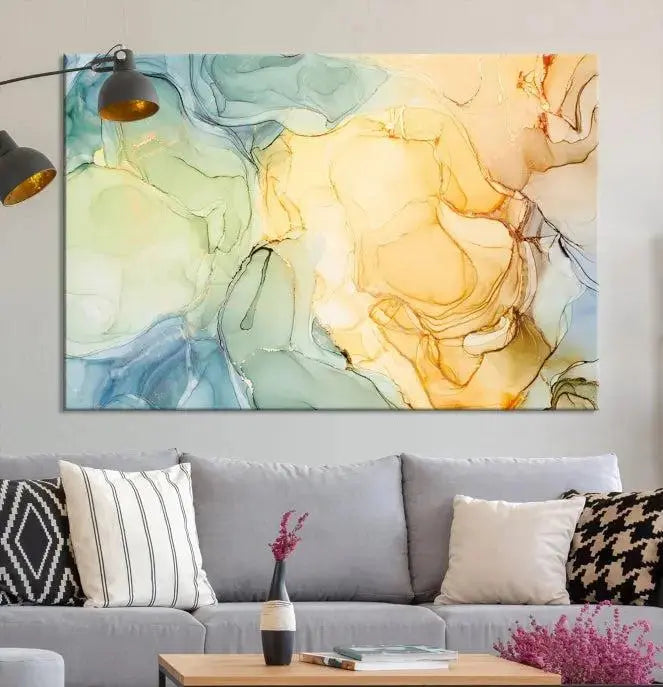 The Green and Yellow Marble Fluid Effect Wall Art Abstract Canvas Wall Art Print in the living room is a striking piece. This three-panel artwork, gallery wrapped on museum-quality canvas, ensures it stands out as a centerpiece in any setting.