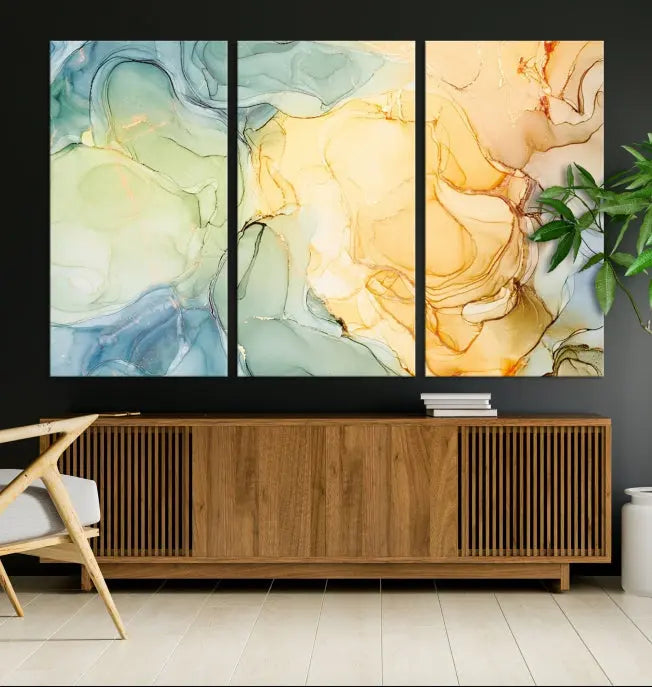 The Green and Yellow Marble Fluid Effect Wall Art Abstract Canvas Wall Art Print in the living room is a striking piece. This three-panel artwork, gallery wrapped on museum-quality canvas, ensures it stands out as a centerpiece in any setting.