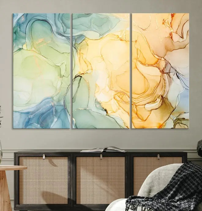 The Green and Yellow Marble Fluid Effect Wall Art Abstract Canvas Wall Art Print in the living room is a striking piece. This three-panel artwork, gallery wrapped on museum-quality canvas, ensures it stands out as a centerpiece in any setting.