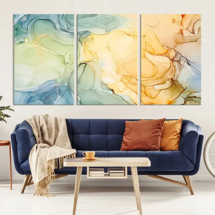 The Green and Yellow Marble Fluid Effect Wall Art Abstract Canvas Wall Art Print in the living room is a striking piece. This three-panel artwork, gallery wrapped on museum-quality canvas, ensures it stands out as a centerpiece in any setting.