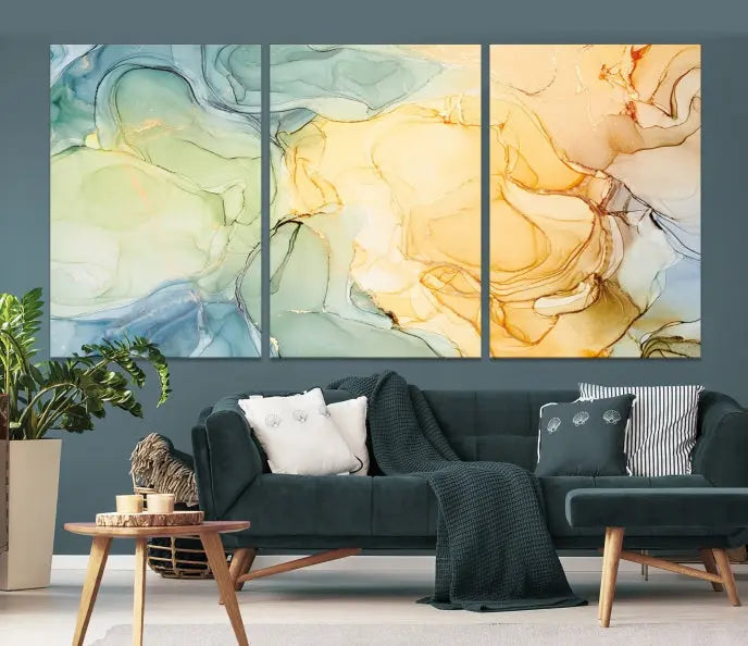 The Green and Yellow Marble Fluid Effect Wall Art Abstract Canvas Wall Art Print in the living room is a striking piece. This three-panel artwork, gallery wrapped on museum-quality canvas, ensures it stands out as a centerpiece in any setting.