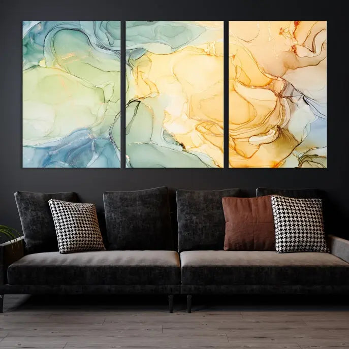 The Green and Yellow Marble Fluid Effect Wall Art Abstract Canvas Wall Art Print in the living room is a striking piece. This three-panel artwork, gallery wrapped on museum-quality canvas, ensures it stands out as a centerpiece in any setting.