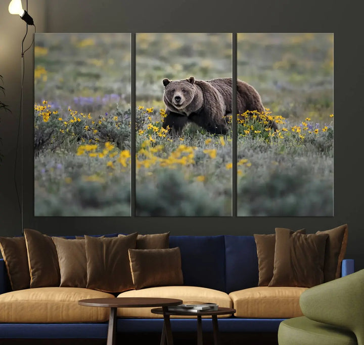 The Grizzly Bears Wall Art, titled "Grizzly 399 in Wild Flowers Wall Art Canvas Print," showcases a majestic bear meandering through vibrant yellow flowers. This piece brings the wild beauty of Grand Teton into your home.