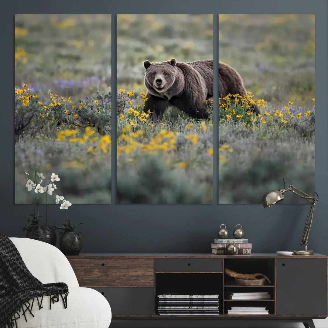 The Grizzly Bears Wall Art, titled "Grizzly 399 in Wild Flowers Wall Art Canvas Print," showcases a majestic bear meandering through vibrant yellow flowers. This piece brings the wild beauty of Grand Teton into your home.