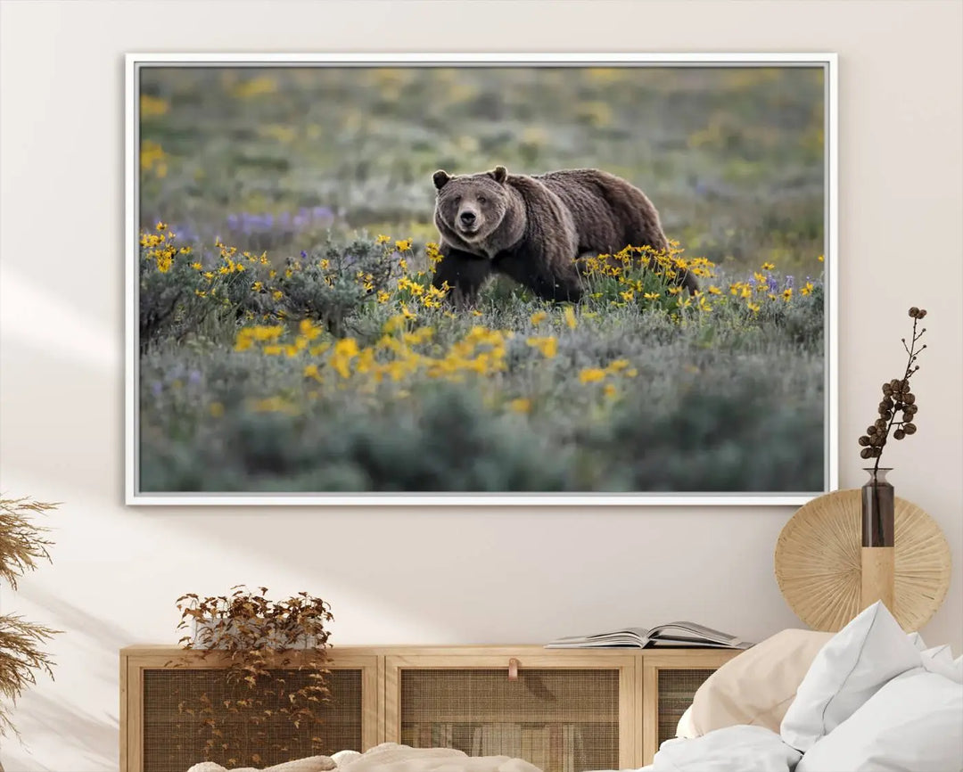 The Grizzly Bears Wall Art, titled "Grizzly 399 in Wild Flowers Wall Art Canvas Print," showcases a majestic bear meandering through vibrant yellow flowers. This piece brings the wild beauty of Grand Teton into your home.