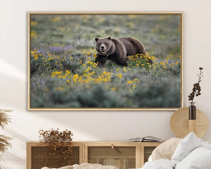 The Grizzly Bears Wall Art, titled "Grizzly 399 in Wild Flowers Wall Art Canvas Print," showcases a majestic bear meandering through vibrant yellow flowers. This piece brings the wild beauty of Grand Teton into your home.