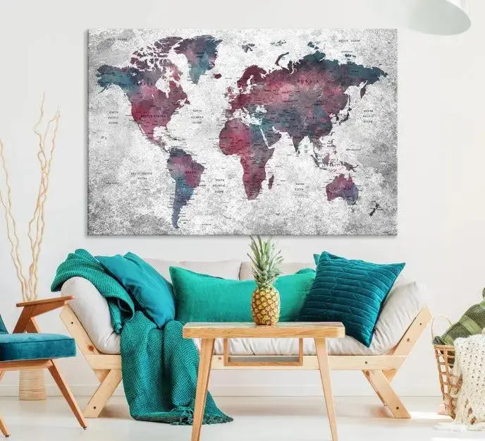 The living room features the Grunge Watercolor World Map Wall Art Canvas Print on a textured gray wall. The map is printed on museum-quality canvas with hand-assembled frames, providing an elegant touch, while its UV-protective coating ensures longevity.