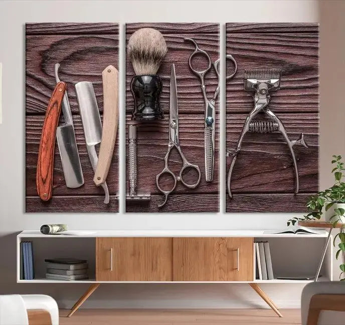 The Hairdresser Tools Wall Art Canvas Print, presented in three panels, showcases vintage barber tools against a wood grain backdrop.