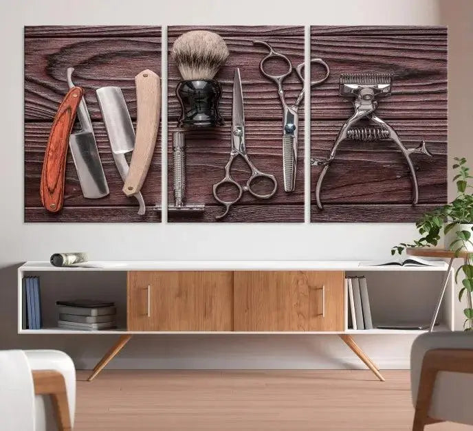 The Hairdresser Tools Wall Art Canvas Print, presented in three panels, showcases vintage barber tools against a wood grain backdrop.