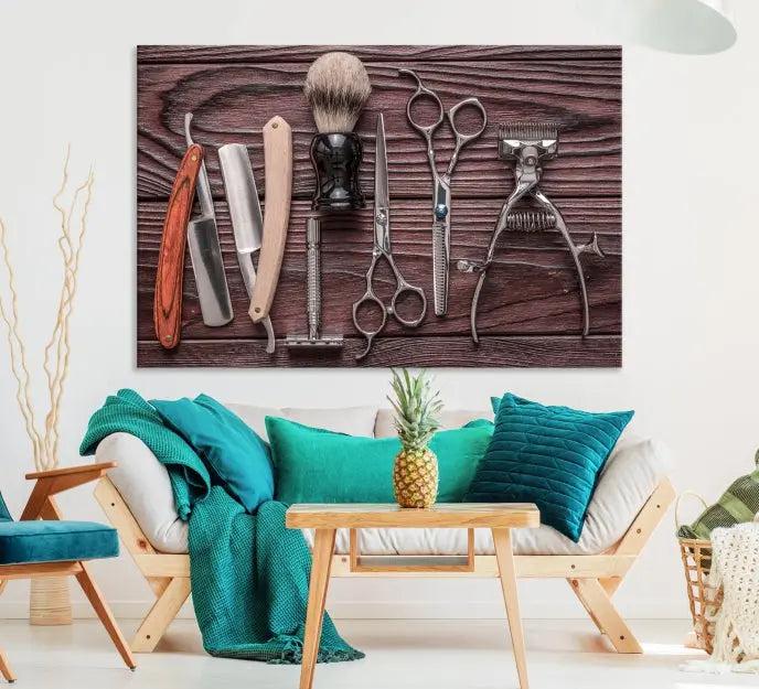 The Hairdresser Tools Wall Art Canvas Print, presented in three panels, showcases vintage barber tools against a wood grain backdrop.