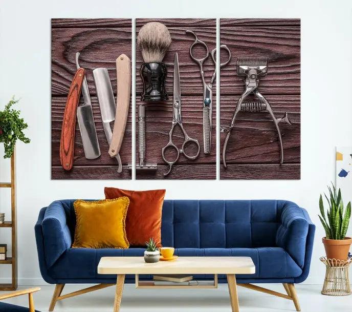 The Hairdresser Tools Wall Art Canvas Print, presented in three panels, showcases vintage barber tools against a wood grain backdrop.