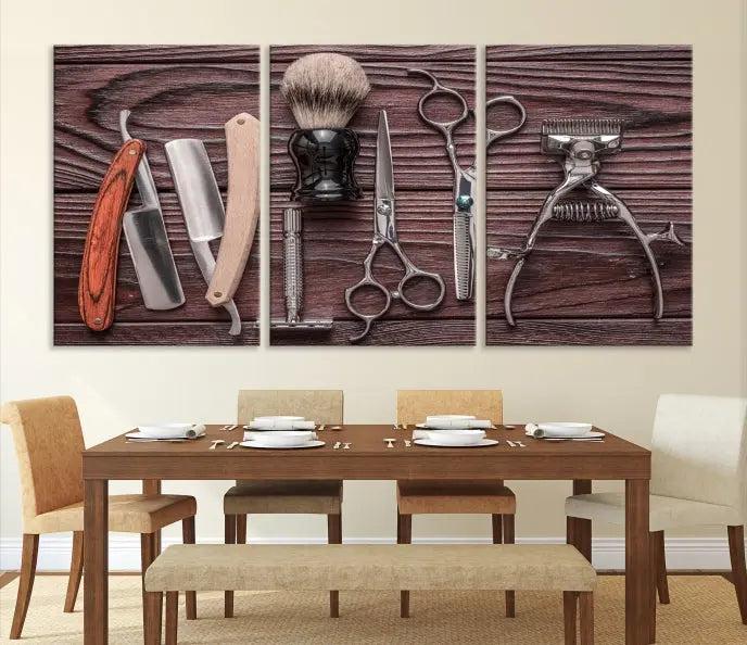 The Hairdresser Tools Wall Art Canvas Print, presented in three panels, showcases vintage barber tools against a wood grain backdrop.