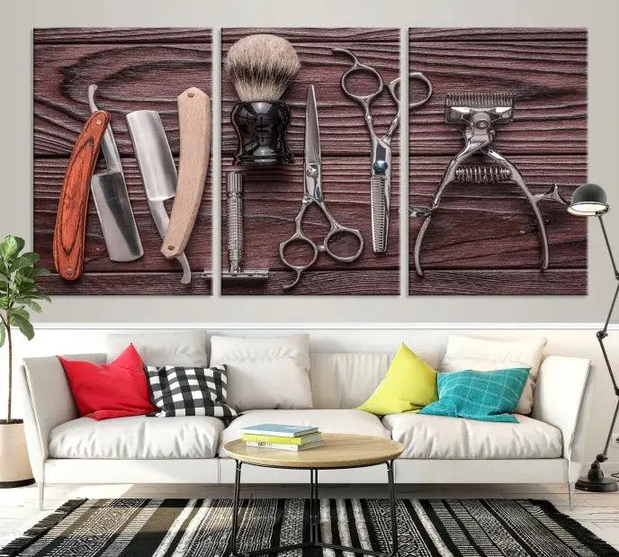 The Hairdresser Tools Wall Art Canvas Print, presented in three panels, showcases vintage barber tools against a wood grain backdrop.