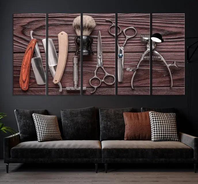 The Hairdresser Tools Wall Art Canvas Print, presented in three panels, showcases vintage barber tools against a wood grain backdrop.