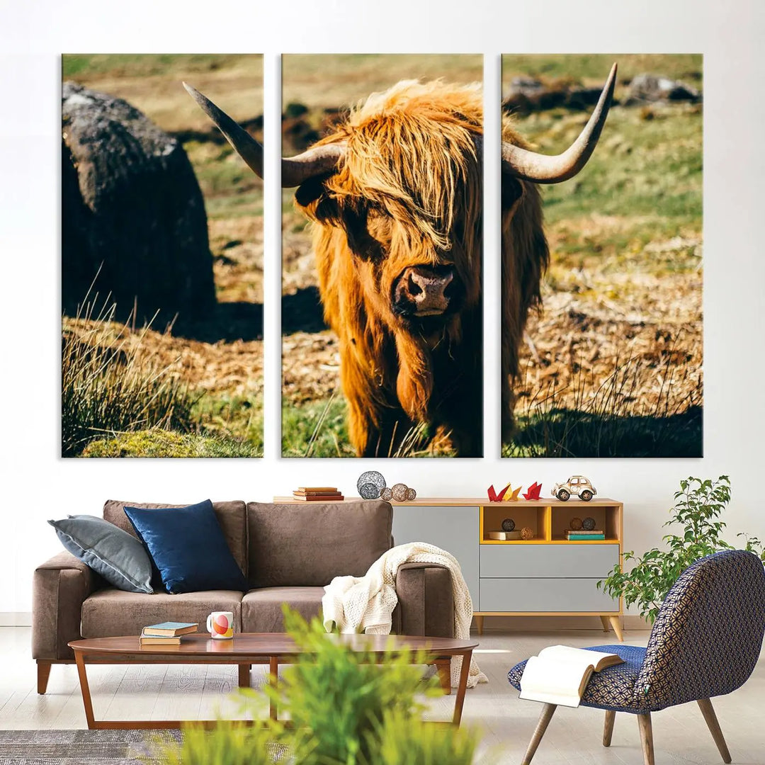 The living room features the Highland Cow Canvas Wall Art, a triptych printed on museum-quality canvas, displayed gracefully above.