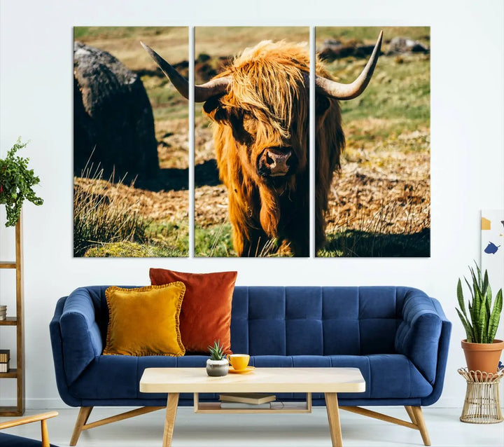 The living room features the Highland Cow Canvas Wall Art, a triptych printed on museum-quality canvas, displayed gracefully above.