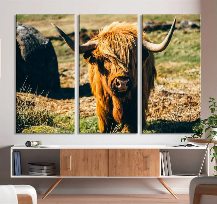 The living room features the Highland Cow Canvas Wall Art, a triptych printed on museum-quality canvas, displayed gracefully above.