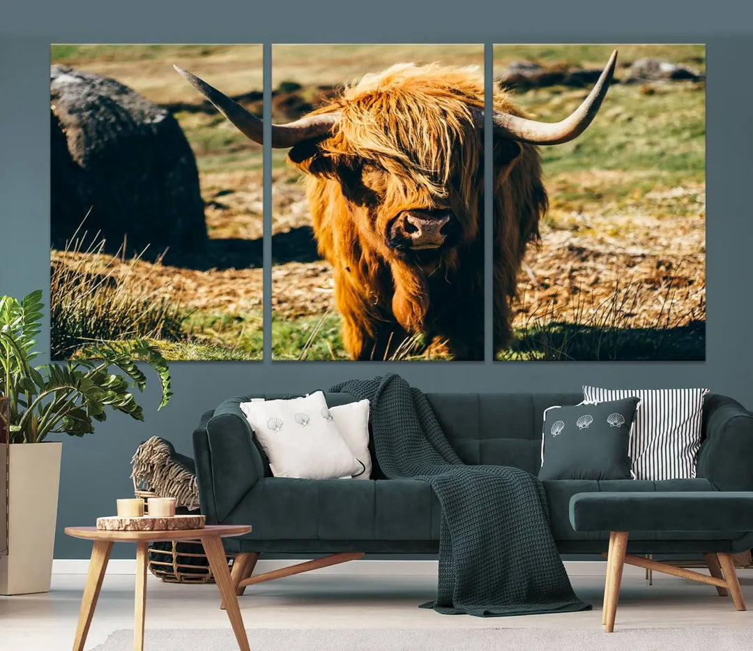 The living room features the Highland Cow Canvas Wall Art, a triptych printed on museum-quality canvas, displayed gracefully above.