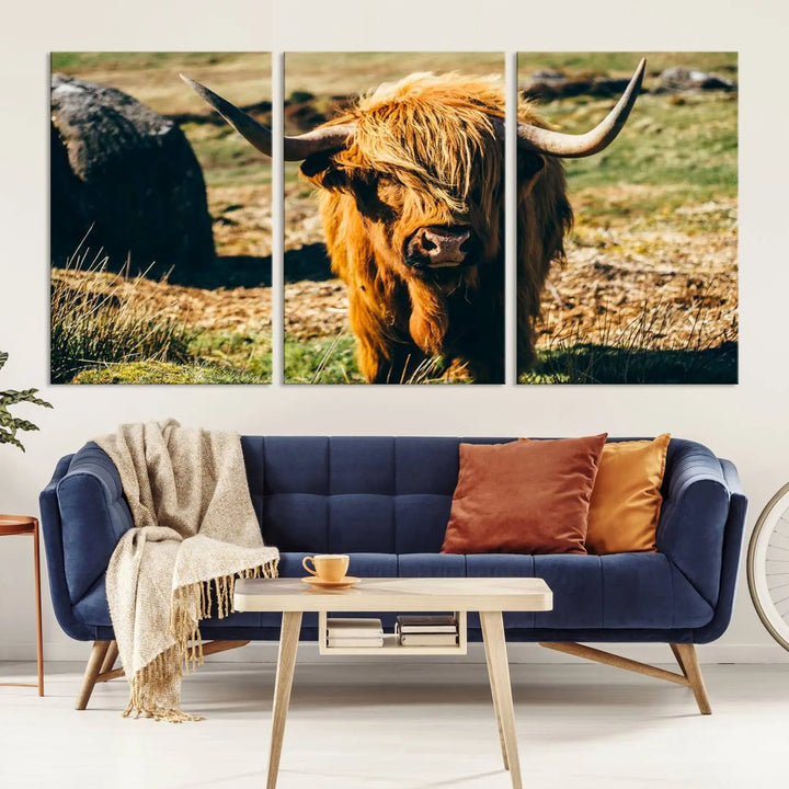 The living room features the Highland Cow Canvas Wall Art, a triptych printed on museum-quality canvas, displayed gracefully above.